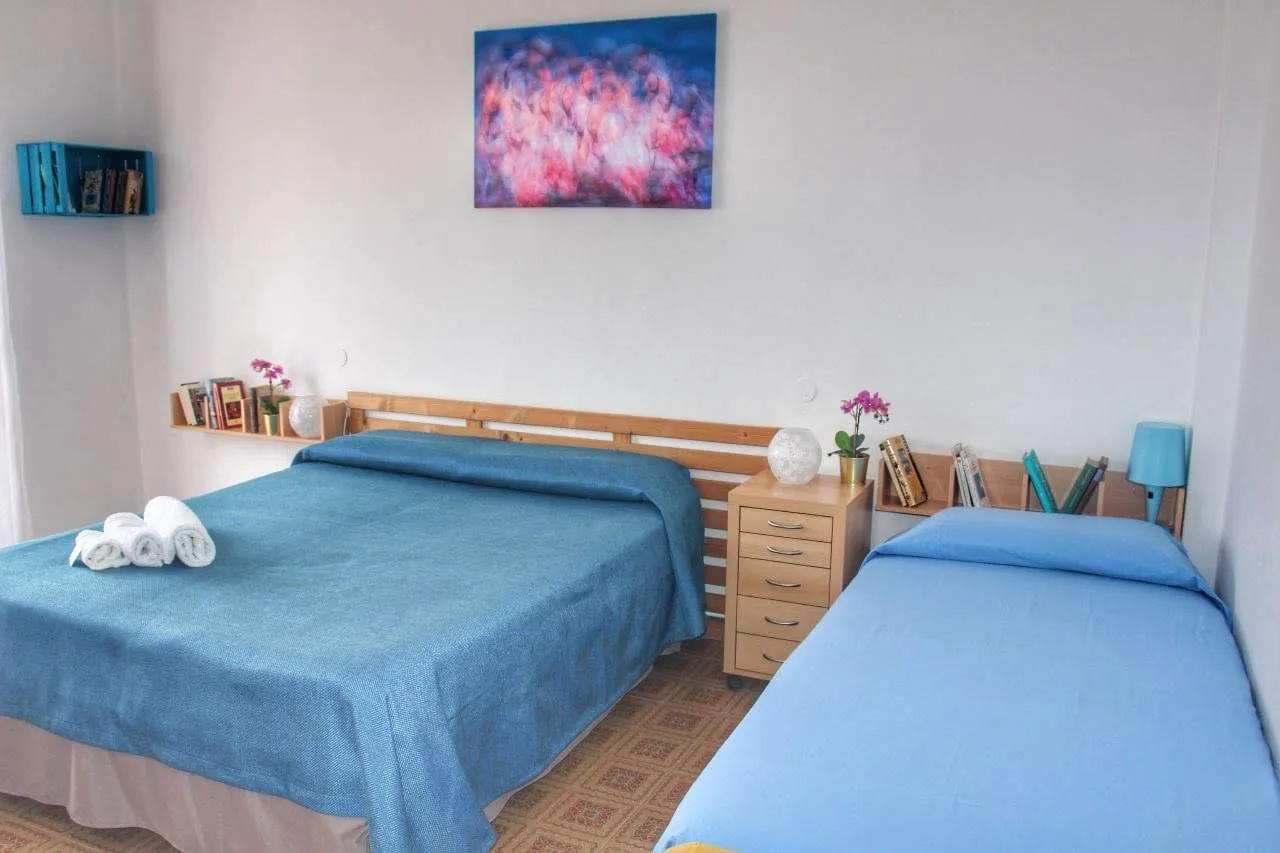 Camera con letto matrimoniale e letto singolo